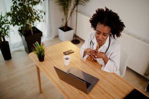 doctor working with certified coders in healthcare