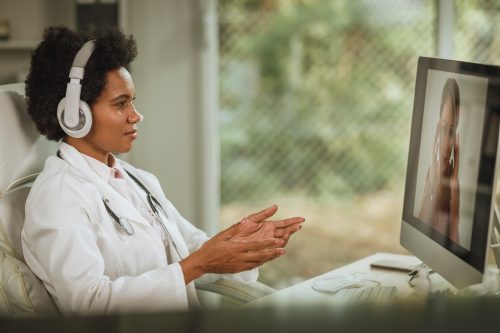 female doctor using one of her telemedicine apps