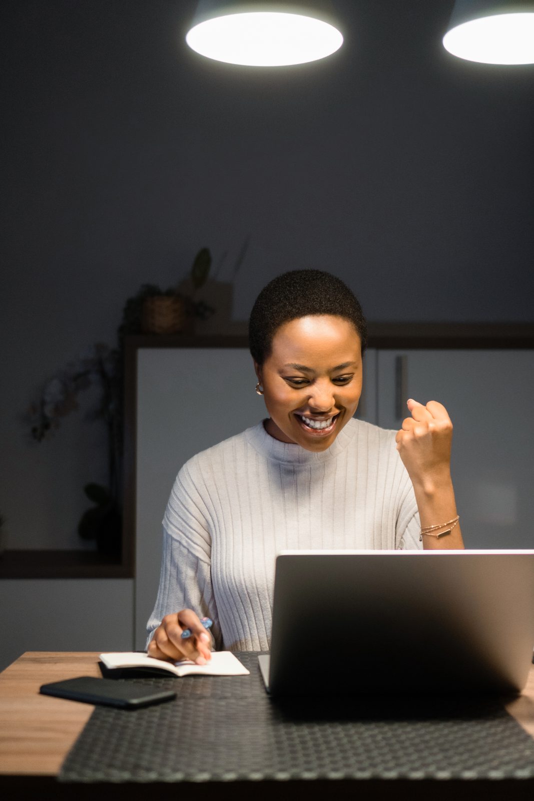 happy employee after knowing about remote work vs. on-site work productivity